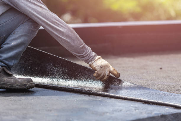 Professional Basement Waterproofing technician working in Butler, MO